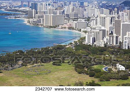 Kapiolani park and buildings along the coastline; Waikiki, Oahu, Hawaii, United States of America View Large Photo Image Stock Photo - Kapiolani park and buildings along the coastline; Waikiki, Oahu, Hawaii, United States of America. Fotosearch