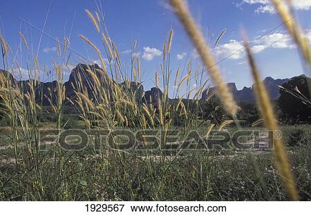 Stock Photo - Karst limestone mountains from Krabi to Ao Nang, Southern Thailand.. Fotosearch