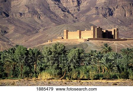 Kasbah In Mountains Above Palm Trees View Large Photo Image Stock Photo - Kasbah In Mountains Above Palm Trees. Fotosearch