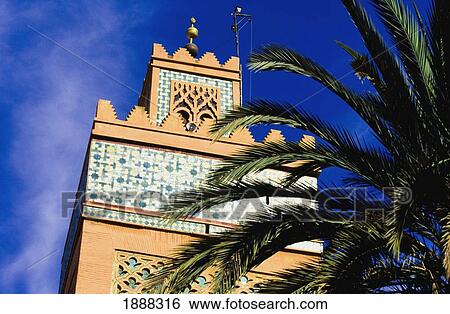 Stock Photograph - Kasbah Mosque's Minaret And Palm Tree. Fotosearch