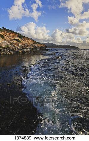 Kauai, Hawaii, United States Of America; Wave-Washed Flat Reef At The Base Of The Makewehi Cliffs Near Poipu View Large Photo Image Stock Photo - Kauai, Hawaii, United States Of America; Wave-Washed Flat Reef At The Base Of The Makewehi Cliffs Near Poipu. Fotosearch