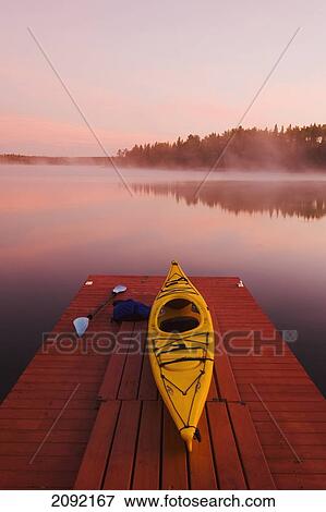Kayak On Dock In Northwestern Ontario; Lake Of The Woods Ontario Canada View Large Photo Image Stock Photo - Kayak On Dock In Northwestern Ontario; Lake Of The Woods Ontario Canada. Fotosearch