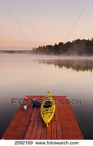 Kayak On Dock In Northwestern Ontario; Lake Of The Woods Ontario Canada View Large Photo Image Stock Photo - Kayak On Dock In Northwestern Ontario; Lake Of The Woods Ontario Canada. Fotosearch