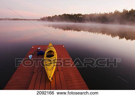Kayak On Dock In Northwestern Ontario; Lake Of The Woods Ontario Canada View Large Photo Image Stock Photograph - Kayak On Dock In Northwestern Ontario; Lake Of The Woods Ontario Canada. Fotosearch
