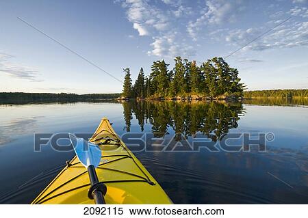 Kayak On Lake In Northwestern Ontario; Lake Of The Woods Ontario Canada View Large Photo Image Stock Photography - Kayak On Lake In Northwestern Ontario; Lake Of The Woods Ontario Canada. Fotosearch