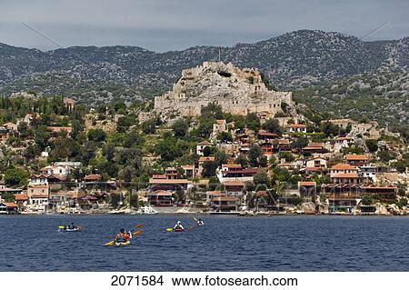 Kayakers In The Fishing Village Of Kalekoy, Lycian Coast, Turkey View Large Photo Image Picture - Kayakers In The Fishing Village Of Kalekoy, Lycian Coast, Turkey. Fotosearch