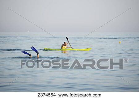 Picture - Kayaking and diving; Puglia, Italy. Fotosearch