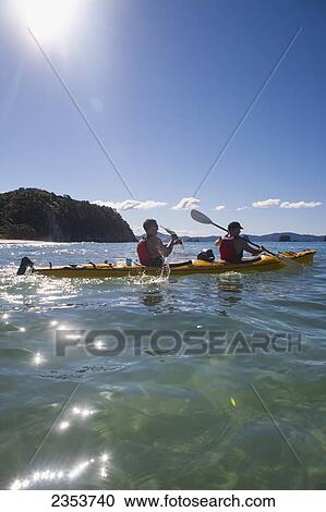 Stock Image - Kayaking On The Coromandel Peninsula; Hahei, New Zealand. Fotosearch