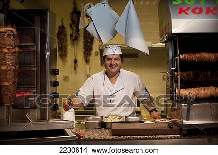 Picture - Kebab shop chef on Cumhuriyet Cadessi, Bodrum, Turkey. Photo. Fotosearch