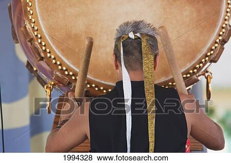 Kenny Endo Performing On The Taiko, A Traditional Japanese Drum At The Powell Street Festival In Woodland Park, Vancouver, British Columbia, Canada View Large Photo Image Stock Photo - Kenny Endo Performing On The Taiko, A Traditional Japanese Drum At The Powell Street Festival In Woodland Park, Vancouver, British Columbia, Canada. Fotosearch