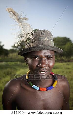 Picture - Kenya, Lake Baringo; Rift Valley, Portrait of traditionally dressed man from Pokot tribe. Fotosearch