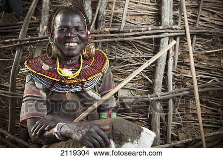 Picture - Kenya, Lake Baringo; Rift Valley, Portrait of traditionally dressed woman from Pokot tribe. Fotosearch