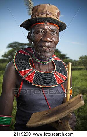 Stock Image - Kenya, Lake Baringo; Rift Valley, Portrait of traditionally dressed man from Pokot tribe. Fotosearch