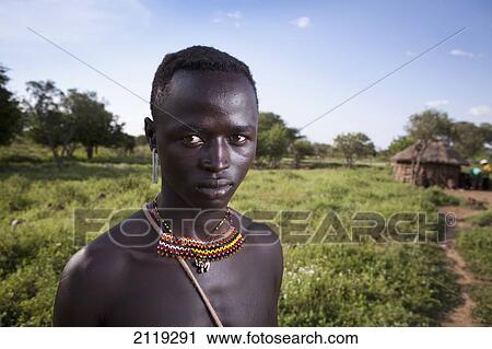 Stock Image - Kenya, Lake Baringo; Rift Valley, Portrait of traditionally dressed man from Pokot tribe. Fotosearch