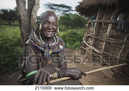 Stock Image - Kenya, Lake Baringo; Rift Valley, Portrait of traditionally dressed senior woman from Pokot tribe. Fotosearch