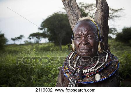 Stock Image - Kenya, Lake Baringo; Rift Valley, Portrait of traditionally dressed senior woman from Pokot tribe. Fotosearch