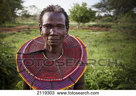 Stock Image - Kenya, Lake Baringo; Rift Valley, Portrait of traditionally dressed woman from Pokot tribe. Fotosearch