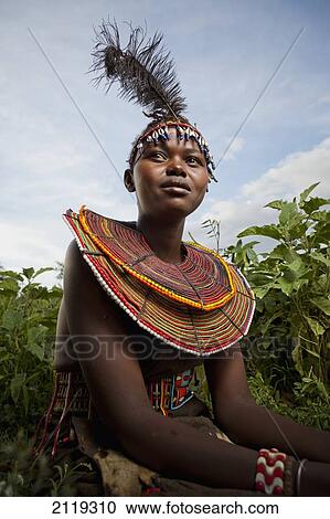 Stock Image - Kenya, Lake Baringo; Rift Valley, Portrait of traditionally dressed woman from Pokot tribe. Fotosearch