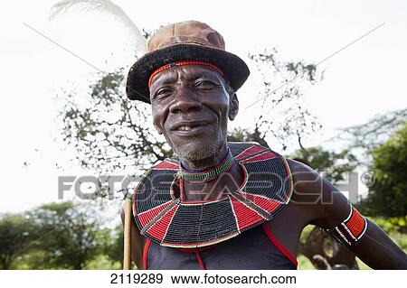Stock Photo - Kenya, Lake Baringo; Rift Valley, Portrait of traditionally dressed man from Pokot tribe. Fotosearch