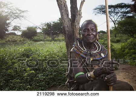 Kenya, Lake Baringo; Rift Valley, Portrait of traditionally dressed senior woman from Pokot tribe View Large Photo Image Stock Photo - Kenya, Lake Baringo; Rift Valley, Portrait of traditionally dressed senior woman from Pokot tribe. Fotosearch
