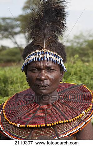 Kenya, Lake Baringo; Rift Valley, Portrait of traditionally dressed woman from Pokot tribe View Large Photo Image Stock Photo - Kenya, Lake Baringo; Rift Valley, Portrait of traditionally dressed woman from Pokot tribe. Fotosearch
