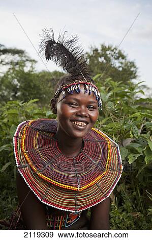 Kenya, Lake Baringo; Rift Valley, Portrait of traditionally dressed woman from Pokot tribe View Large Photo Image Stock Photo - Kenya, Lake Baringo; Rift Valley, Portrait of traditionally dressed woman from Pokot tribe. Fotosearch