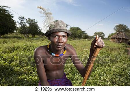 Kenya, Lake Baringo; Rift Valley, Portrait of traditionally dressed man from Pokot tribe View Large Photo Image Stock Photography - Kenya, Lake Baringo; Rift Valley, Portrait of traditionally dressed man from Pokot tribe. Fotosearch