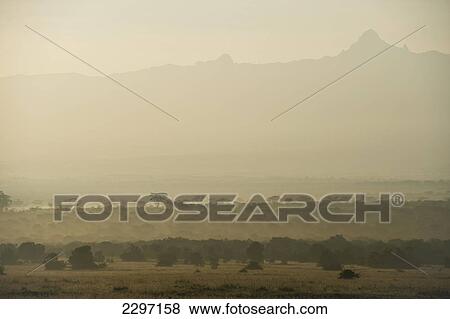 Stock Photo - Kenya, Looking across Ol Pejeta Conservancy at dawn to Mt Kenya; Laikipia County. Fotosearch