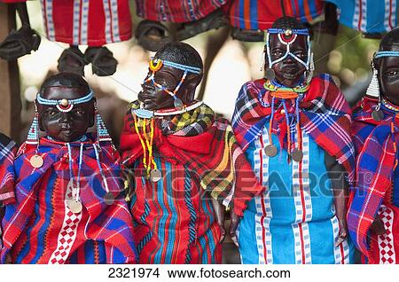 Picture - Kenya, Nairobi, Tribesman dolls dressed in colorful clothing. Fotosearch