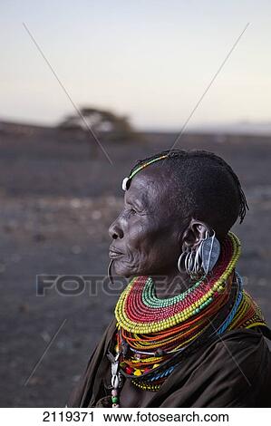 Stock Image - Kenya, Portrait of traditionally dressed Turkana woman on Lake Turkana; Loyangalani. Fotosearch