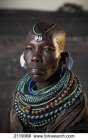 Kenya, Portrait of traditionally dressed Turkana woman on Lake Turkana; Loyangalani View Large Photo Image Stock Photo - Kenya, Portrait of traditionally dressed Turkana woman on Lake Turkana; Loyangalani. Fotosearch