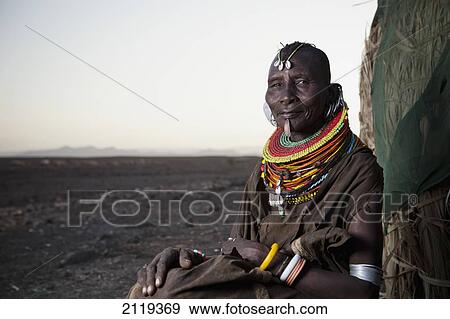 Kenya, Portrait of traditionally dressed Turkana woman on Lake Turkana; Loyangalani View Large Photo Image Stock Photo - Kenya, Portrait of traditionally dressed Turkana woman on Lake Turkana; Loyangalani. Fotosearch