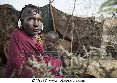 Kenya, Portrait of traditionally dressed Turkana woman and child on Lake Turkana; Loyangalani View Large Photo Image Stock Photo - Kenya, Portrait of traditionally dressed Turkana woman and child on Lake Turkana; Loyangalani. Fotosearch