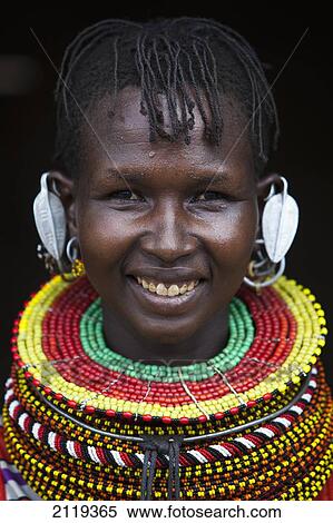 Stock Photography - Kenya, Portrait of traditionally dressed Turkana woman on Lake Turkana; Loyangalani. Fotosearch