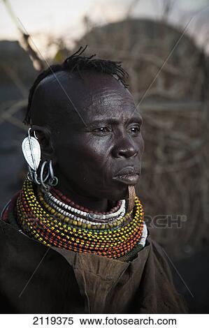 Stock Photography - Kenya, Portrait of traditionally dressed Turkana woman on Lake Turkana; Loyangalani. Fotosearch