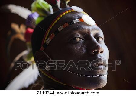Picture - Kenya, Portrait of young Samburu man (Moran) in traditional dress; South Horr. Fotosearch