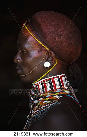 Stock Image - Kenya, Portrait of young Samburu man (Moran) in traditional dress; South Horr. Fotosearch