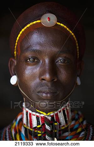 Stock Image - Kenya, Portrait of young Samburu man (Moran) in traditional dress; South Horr. Fotosearch