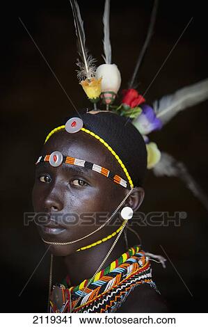 Stock Image - Kenya, Portrait of young Samburu man (Moran) in traditional dress; South Horr. Fotosearch