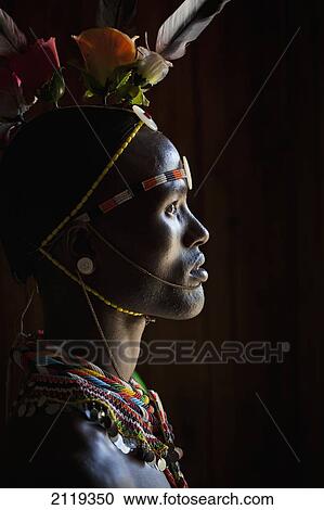 Stock Image - Kenya, Portrait of young Samburu man (Moran) in traditional dress; South Horr. Fotosearch