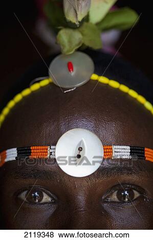 Stock Photo - Kenya, Portrait of young Samburu man (Moran) in traditional dress; South Horr. Fotosearch