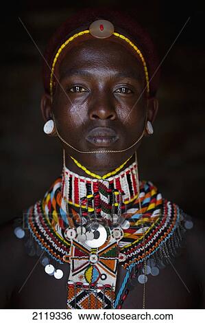 Stock Photograph - Kenya, Portrait of young Samburu man (Moran) in traditional dress; South Horr. Fotosearch