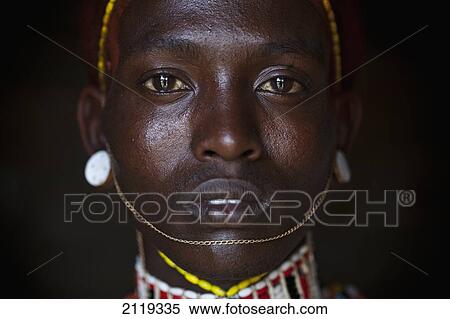 Stock Photography - Kenya, Portrait of young Samburu man (Moran) in traditional dress; South Horr. Fotosearch