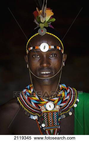 Stock Photography - Kenya, Portrait of young Samburu man (Moran) in traditional dress; South Horr. Fotosearch