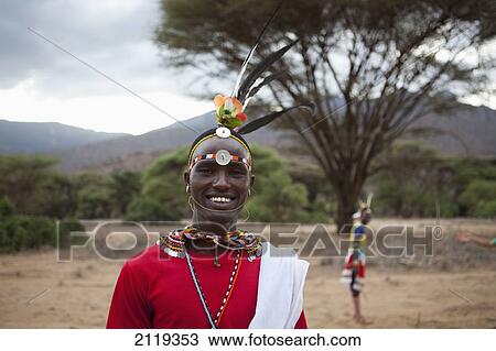 Stock Image - Kenya, Portrait of young Samburu Moran (warrior) in traditional dress; South Horr. Fotosearch