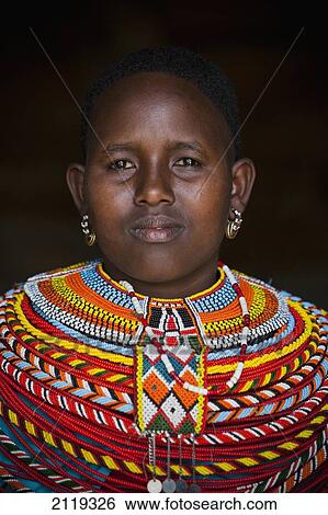 Stock Photograph - Kenya, Portrait of young Samburu woman in traditional dress; South Horr. Fotosearch