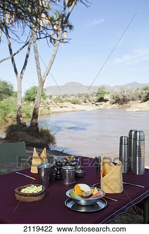Kenya, Riverside breakfast table set up for guests at Joy's Camp; Shaba National Reserve View Large Photo Image Stock Image - Kenya, Riverside breakfast table set up for guests at Joy's Camp; Shaba National Reserve. Fotosearch