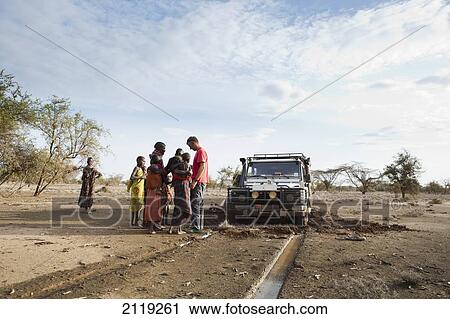 Kenya, View of people standing next to Landrover; North Turkana View Large Photo Image Stock Image - Kenya, View of people standing next to Landrover; North Turkana. Fotosearch