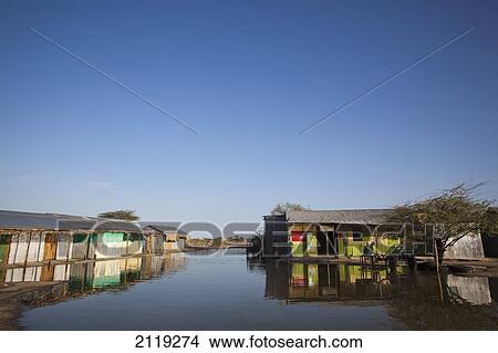 Picture - Kenya, View of village with flooded street; Turkana. Fotosearch