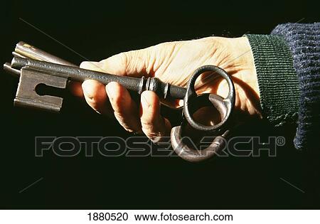 Stock Image - Keys To The Cathedral Door In Wardens Hand. Fotosearch